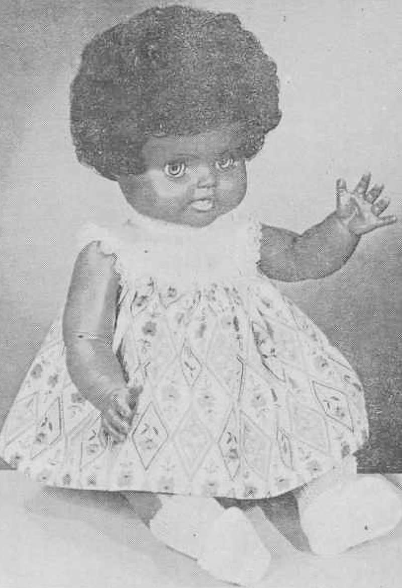 A black plastic doll